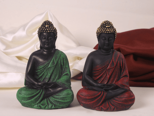 red and green meditating buddha pair front view